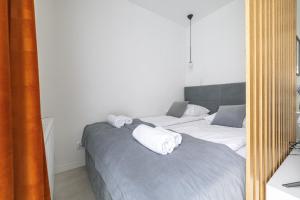 Posteľ alebo postele v izbe v ubytovaní Apartamenty Central Gdańsk Q4Apartments