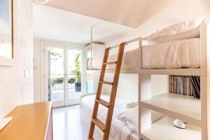 A bed or beds in a room at Carattino 12 Idyllic Seafront Retreat