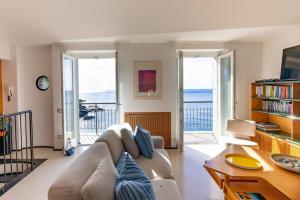 A seating area at Carattino 12 Idyllic Seafront Retreat
