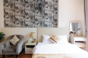 Postel nebo postele na pokoji v ubytování TTR Vincent Hotel