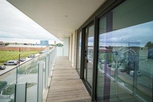 Balkón nebo terasa v ubytování Huswell - Beautiful apartment with communal pool and gym