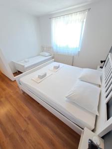 Postel nebo postele na pokoji v ubytování Holiday House Meri