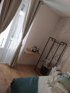 Łóżko lub łóżka w pokoju w obiekcie Habitaciones Universal