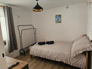 a bedroom with a bed with two pillows on it at Przy potoku in Średnia Wieś +10 photos