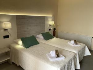 Postel nebo postele na pokoji v ubytování Hotel Sancho III