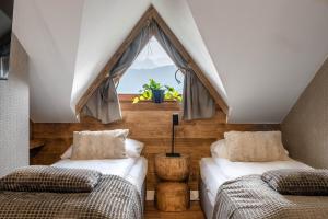 Posteľ alebo postele v izbe v ubytovaní Apartamenty Tatra View Kościelisko