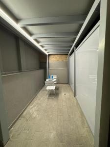 an empty hallway with a bench in a room at Effealatapartments - EdenLoft in Senigallia +30 photos