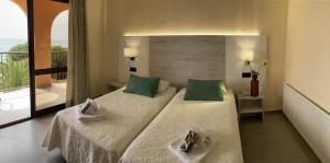 Postel nebo postele na pokoji v ubytování Hotel Sancho III