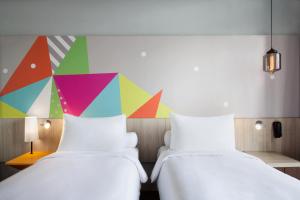 Voodi või voodid majutusasutuse Ibis Styles Jakarta Sunter toas