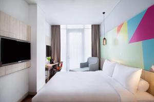Voodi või voodid majutusasutuse Ibis Styles Jakarta Sunter toas