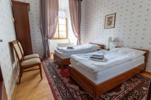 Postel nebo postele na pokoji v ubytování Zámek Lnáře