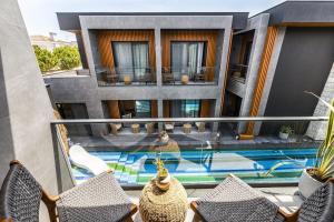 a view of a building with a swimming pool at The Grey Alaçatı in Çeşme