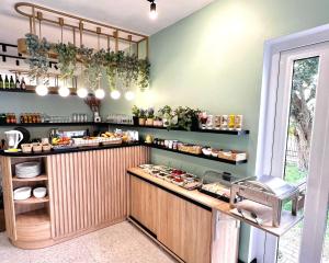 a kitchen with a counter with food on it at B&B Fajne Miejsce in Łeba +34 photos