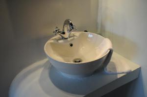 a white sink sitting on top of a counter at Naiades Village in Polydrossos +23 photos