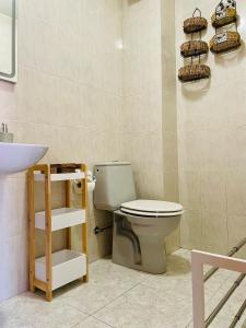 a bathroom with a toilet and a sink at Piso vistas al mar 2. Playa Aguete. Rías Baixas in Marín