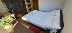 a small bedroom with a bed in a room at Apartament Gdynia Babie Doły in Gdynia +26 photos