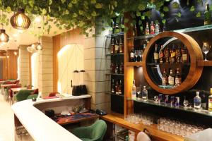 a bar with a lot of bottles on the wall at Hotel Samrat Ajmer in Ajmer