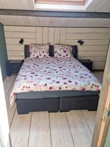 Postel nebo postele na pokoji v ubytování vakantiehuis en appartement De Harscamp