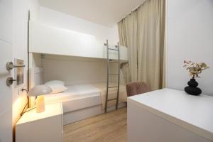 Ένα ή περισσότερα κρεβάτια σε δωμάτιο στο Tomas garden lux apartment