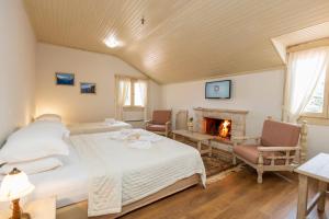 A bed or beds in a room at Dimatis
