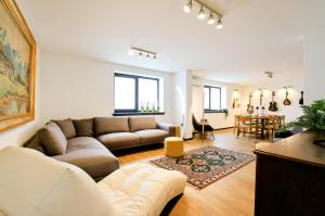 a living room with a couch and a table at Feel Good in Ravna Gora