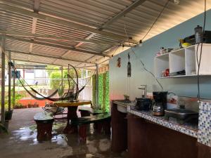 a kitchen with a sink and a table in it at Pez Espada in Drake