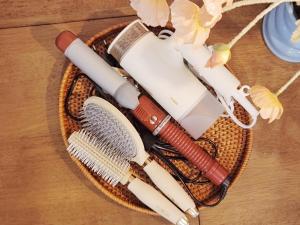 a wicker basket filled with different types of brushes at MoonStay in Seoul