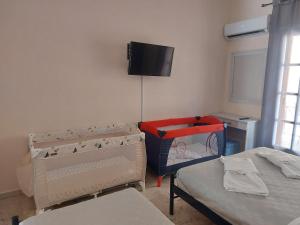 Postel nebo postele na pokoji v ubytování AK VILLAGE ROOMS