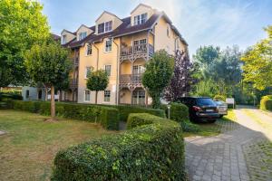 a house with a car parked in front of it at Ostseewelle 5 in Kühlungsborn