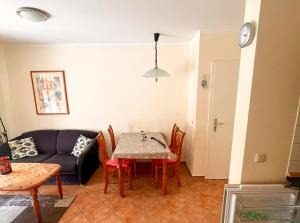 a living room with a table and a couch at Ostseewelle 5 in Kühlungsborn +1 photo
