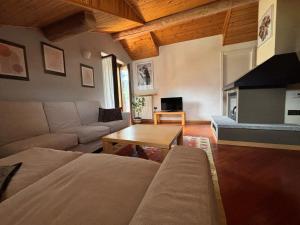 a living room with a couch and a table at La Casa di Armando in Bormio