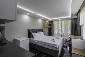 Postel nebo postele na pokoji v ubytování Terra Garden Hotel