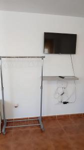 Televízia a/alebo spoločenská miestnosť v ubytovaní Loft 1 Nuevo primer piso sin ascensor,wifi