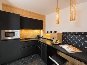 Kuchyň nebo kuchyňský kout v ubytování Alpinlodge & Spa