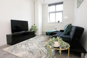 Μια τηλεόραση ή/και κέντρο ψυχαγωγίας στο Modern Luxury 2Bed Apartment - City Centre