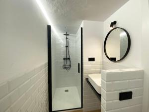 a white bathroom with a sink and a mirror at Casa BlauBegur - ref 056 in Begur