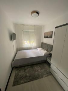 Ένα ή περισσότερα κρεβάτια σε δωμάτιο στο Ostro Two Bedrooms