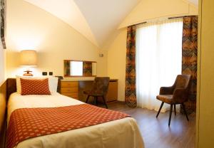 Postel nebo postele na pokoji v ubytování Hotel Bouton d'Or - Courmayeur