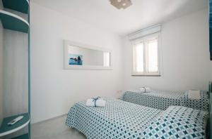 Ένα ή περισσότερα κρεβάτια σε δωμάτιο στο Minerva Luxury Apartment & Tulipan Apartment by Taormina Holidays +24 φωτογραφίες