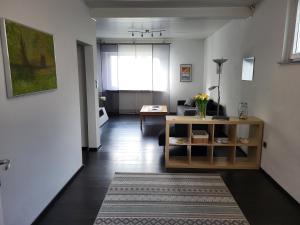 a living room with a couch and a table at Ferienwohnung Braunshardt in Weiterstadt