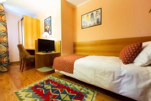 Postel nebo postele na pokoji v ubytování Hotel Bouton d'Or - Courmayeur