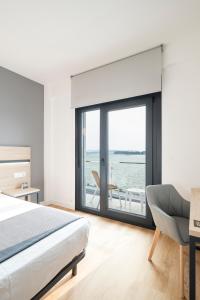 Postel nebo postele na pokoji v ubytování Hotel Alda Vía Norte