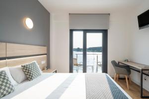 Postel nebo postele na pokoji v ubytování Hotel Alda Vía Norte