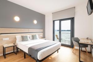 Postel nebo postele na pokoji v ubytování Hotel Alda Vía Norte