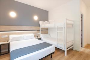 Postel nebo postele na pokoji v ubytování Hotel Alda Vía Norte