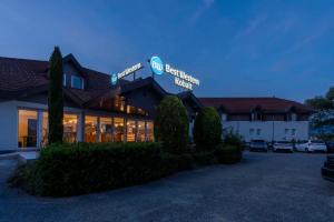 a hotel with a parking lot in front of it at Best Western Kobalt Annecy Nord - Epagny in Épagny +75 photos