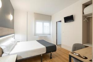 TV a/nebo společenská místnost v ubytování Hotel Alda Vía Norte