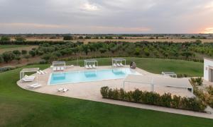 an aerial view of a villa with a swimming pool at Masseria Elysium in Mesagne