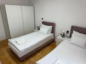 Letto o letti in una camera di M2-apartments
