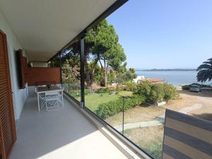 a balcony with a view of the ocean at Diafanos Beach Apartments in Vourvourou
